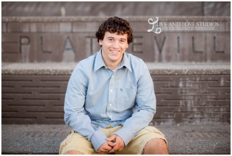 minneapolis-st-paul-mn-high-school-senior-boy-sitting-brickwall